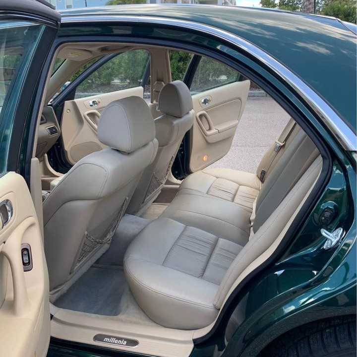 Rear seating of 1999 Mazda Millenia S with tan leather seats